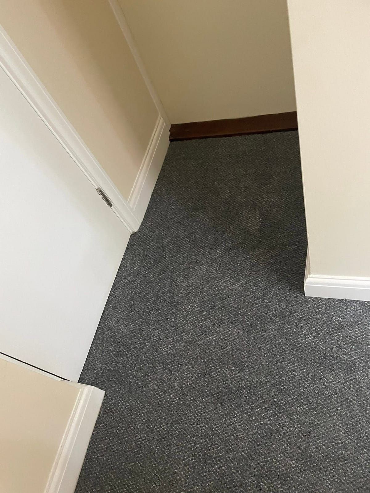 Grey contract carpet in a communal corridor