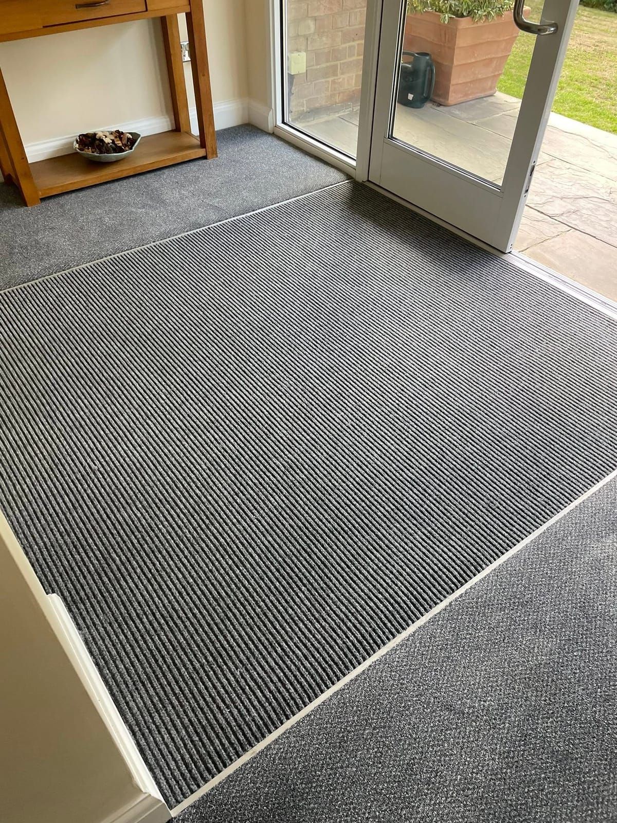Entrance matting with an aluminium trim at a communal entrance