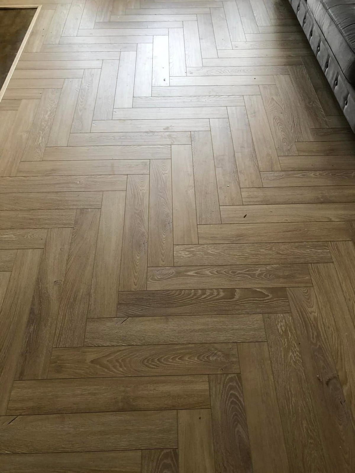 Close-up of oak herringbone flooring