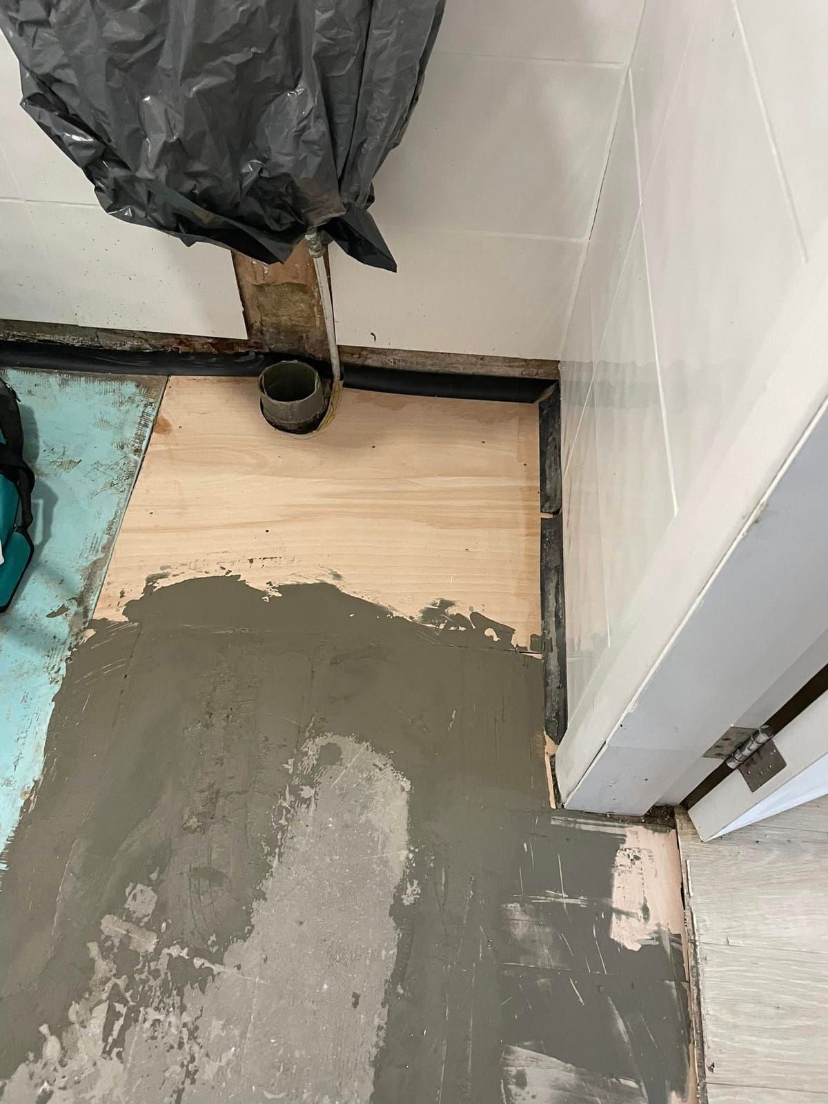 New ply boarding and levelling compound laid over the repaired bathroom floor