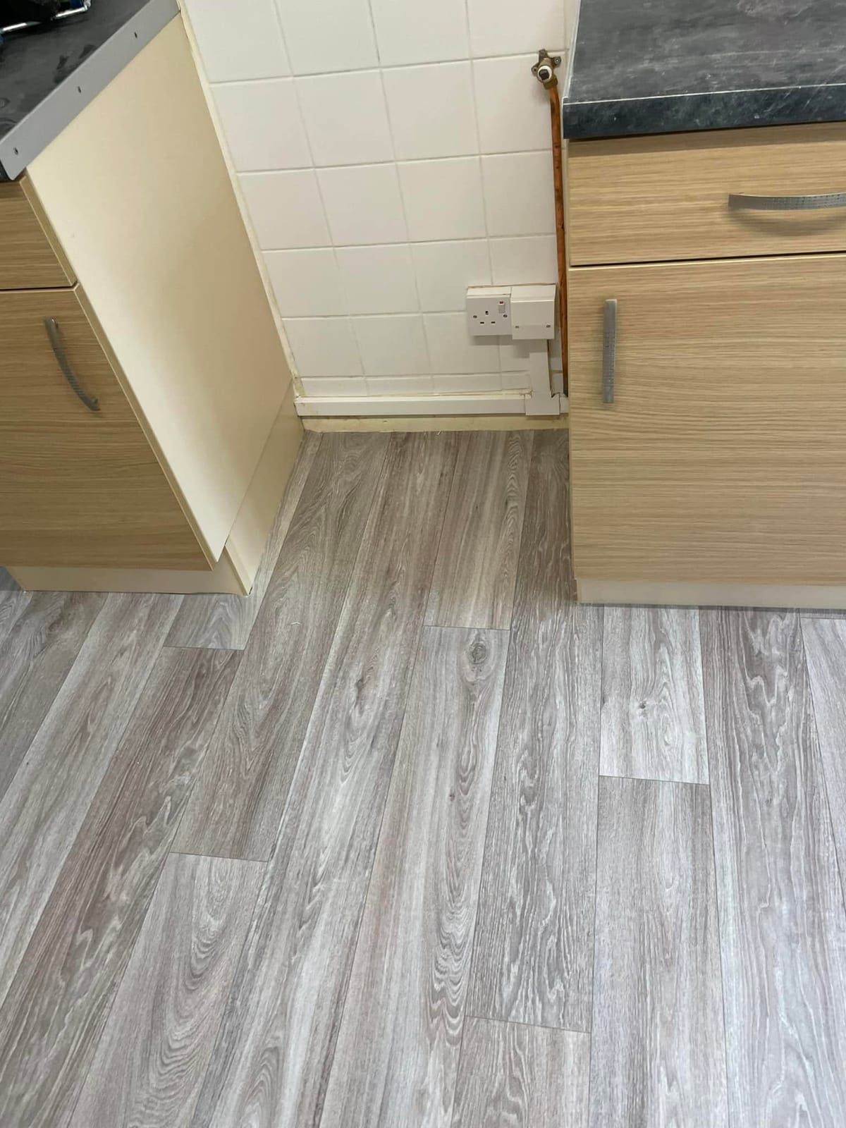 Grey oak-effect vinyl in a kitchen